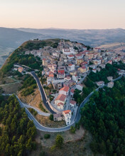 Italy, Campania, Cairano, Aerial View Of Hilltop Town At Dusk