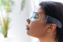 Woman Relaxing With Closed Eyes Wearing Cyber Glasses