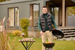 © zinkevych - Pleased guy grilling food on the grill
