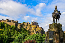 The Royal Scots Greys Monument Statue In Princes Street Gardens, With Edinburgh Castle In The Background.