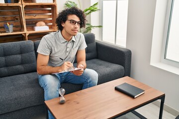 Poster - Young hispanic man psychologist having session at psychology center