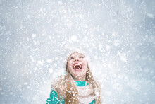 A Snowy Blue Background With A Happy Kid On It.