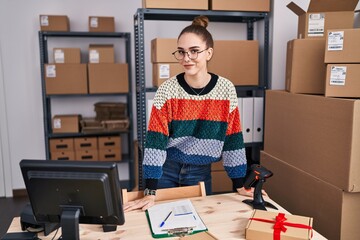 Wall Mural - Young woman ecommerce business worker smiling confident standing at office