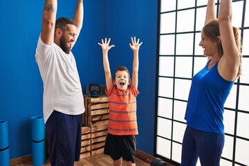 Sticker - Family smiling confident with hands raised up at sport center