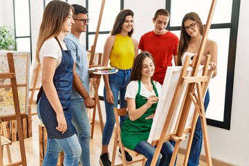 Poster - Group of people smiling happy and looking draw of partner at art studio.