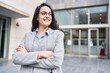 © Krakenimages.com - Young hispanic woman executive smiling confident standing with arms crossed gesture at street