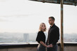 © anna_gorbenko - Romantic, young and happy caucasian couple in stylish clothes on the rooftop enjoying view and time together. Art portrait of beautiful woman and man. Love, relationships, romance, happiness concept.