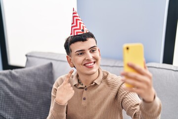 Poster - Non binary person celebrating birthday doing video call smiling happy pointing with hand and finger