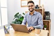 © Krakenimages.com - Young arab man smiling confident using laptop working at office