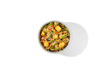 Canvas Print - Fried rice with vegetables, chicken and tofu cheese isolated on white background Traditional chinese food - fried rice with egg in ceramic bowl. Bowl with fried rice, chicken and tofu