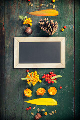 Wall Mural - Autumn background - fallen leaves and healthy food on old wooden table. Thanksgiving day concept