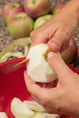 Sticker - Close up of peeling and slicing an apple with a knife