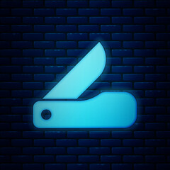 Sticker - Glowing neon Swiss army knife icon isolated on brick wall background. Multi-tool, multipurpose penknife. Multifunctional tool. Vector