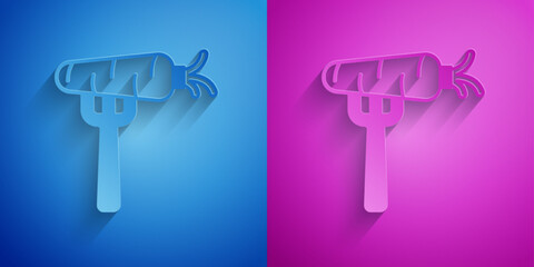 Poster - Paper cut Carrot on fork icon isolated on blue and purple background. Paper art style. Vector