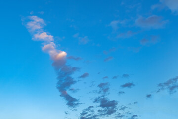 Wall Mural - Blue sky with white clouds. Beautiful cloudy sky. Skyward. Endless skyline. The sky at dawn.