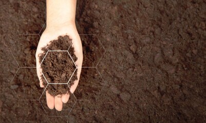 Poster - Agriculture. Hands of the farmer touches fertile soil