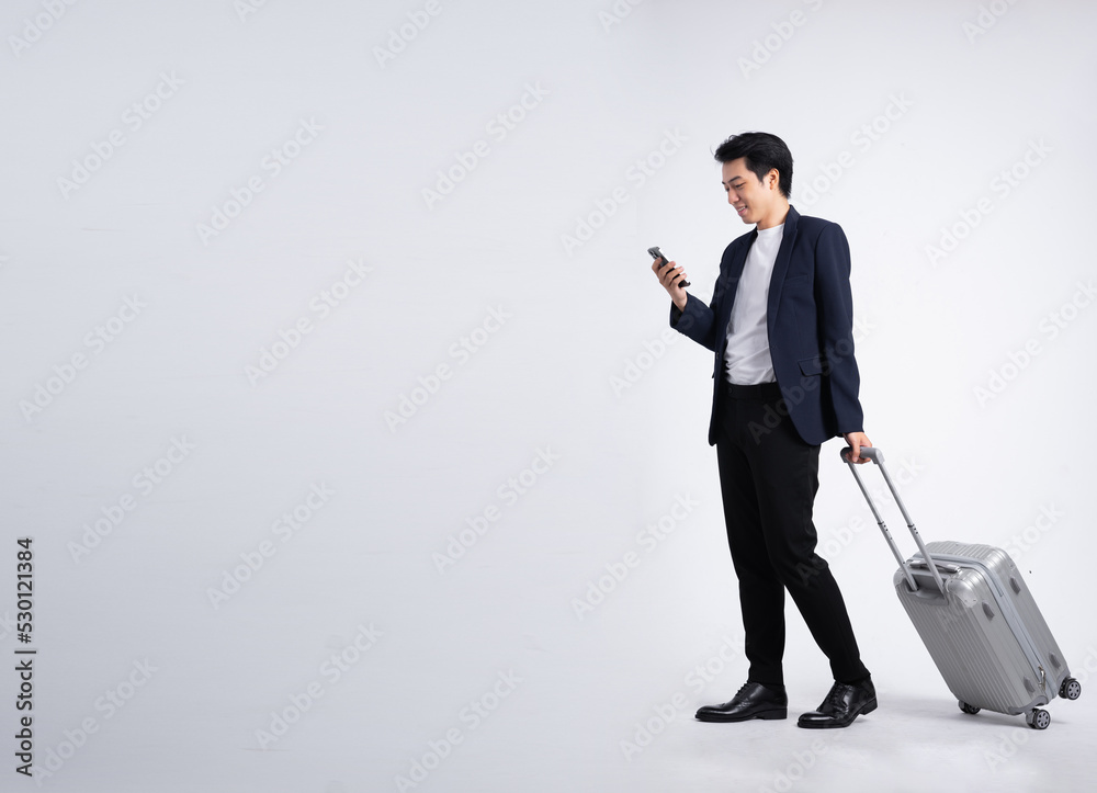 Young business man wearing a suit posing on a white background Stock ...