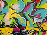 Fototapeta Młodzieżowe - Part of a bright multi-colored wall graffiti. Youth art culture.