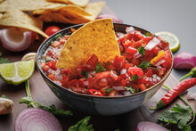 Tortilla Chips And Fresh Salsa Made With Homegrown Ingredients Of Tomatoes, Red Onions, Garlic, Chili Peppers, Cilantro And Lime