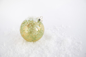 festive christmas ball on white background with snow