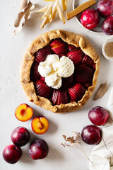 Wall Mural - Plum pie, galette with fruit on white background