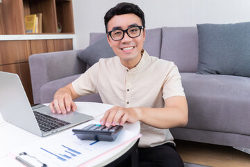 Wall Mural - Young Asian man at home