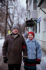 Sticker - Portrait of  elderly man with  mature wife on  winter city street