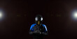 Biker motorcyclist in a protective motorcycle jacket with gloves and a helmet on a dark background. Helmet sun visor.