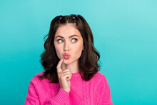 Closeup Photo Of Young Attractive Pretty Woman Wear Pink Knitted Sweater Touch Cheeks Pouted Lips Look Empty Space Isolated On Cyan Color Background