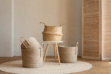 Various Wicker Baskets For Interior Decoration Stand On The Floor In A Modern Living Room.