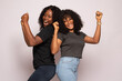 Leinwandbild Motiv two african girls excited and rejoicing