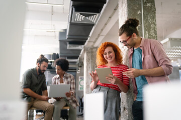 Portrait of creative business team working, smiling together at startup company.