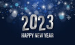 Happy New Year 2023. Dark blue illuminated background with snowflakes, stars, glitter and text.
