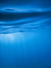 Wall Mural - Underwater sea surface, Blue background