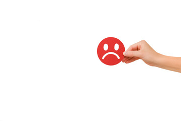 Female hand holding red angry face emoticon, isolated on white background with copy space for advertising. Feedback rating, emotional intelligence, mental health assessment, bipolar disorder concept