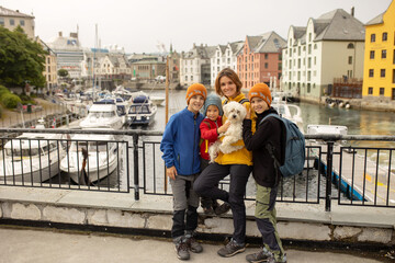 Poster - Family, kids, adults and dog, enjoying family vacation in Alesund, beautiful city in Norway