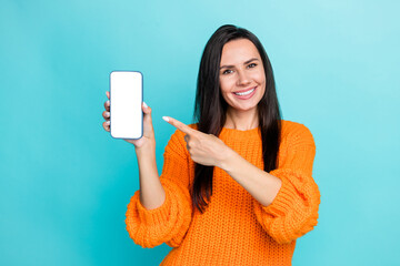 Aufkleber - Portrait of positive girl indicate finger demonstrate empty space telephone display isolated on cyan color background
