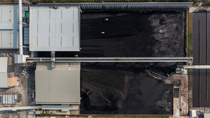 Poster - Aerial top view moving belt with heap of coal next to the coal power plant, Coal mining view from above,