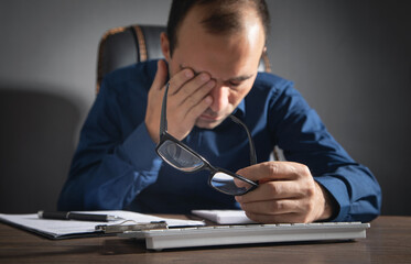 Wall Mural - Caucasian man with eye fatigue. Stress. Eyesight problem