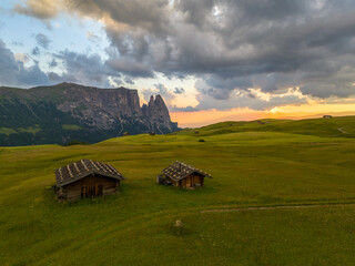 Fototapete - Sunrise in the Dolomites mountains with fog and mist rolling around the peaks. Hiking path leading to the hills. 