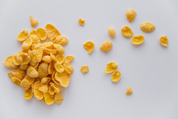 Wall Mural - top view of dry and crispy corn flakes isolated on white.