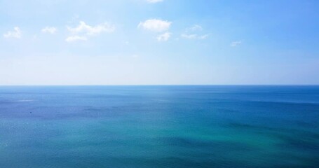 Wall Mural - Blue ocean sea horizon as far as the eye can see One part sky, one part sea. Aerial view shot by drone camera 