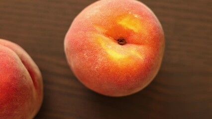 Wall Mural - Ripe peaches on wooden board close up