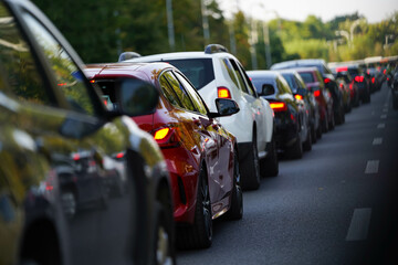 traffic. cars caught in the crowd. photo taken in the evening. people in traffic returning from work.