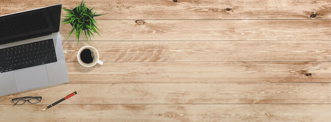 Fototapete - Flat lay of top view desk work table with computer notebook and pencil work space on wood background includes copyspace for add text or graphic