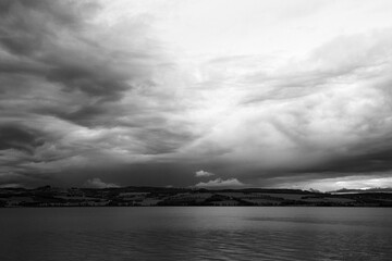 Wall Mural - a cloudy and gloomy autumn evening above lake mjøsa