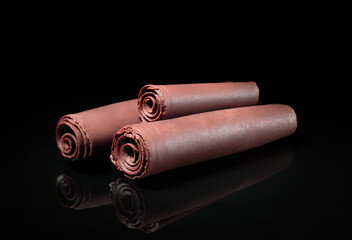 Aufkleber - Chocolate Curls with on black background
