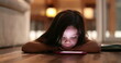 © Marco - Child watching cellphone screen at night. Blue light from smartphone device glowing on little girl face