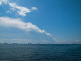 Fototapeta Tęcza - clouds over the sea