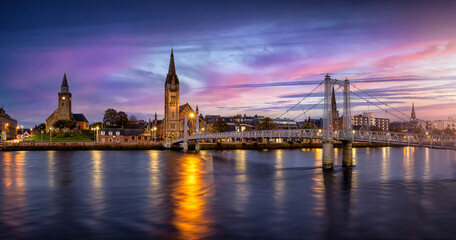 Wall Mural - Panoramic view of the cityscape of Inverness, Scotland, during evening time with Greig Street Bridge, River Ness and the old town